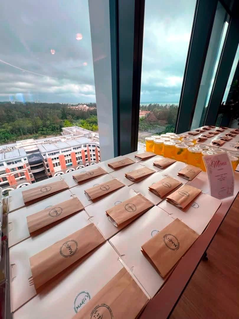 Individually packed meal bags lined up at an event venue